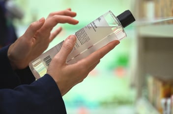 Person holding a product with a clear label